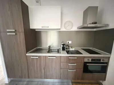 a bathroom with a sink and a mirror at Appartement Lido de la Marana in Lucciana