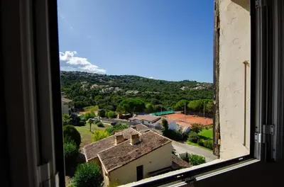 a view from a window of a village at Duplex 2 chambres, vue mer & balcon - 6 couchages in Porticcio
