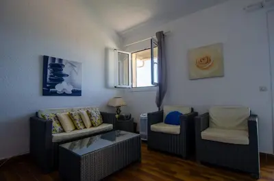 a living room with two couches and a window at Duplex 2 chambres, vue mer & balcon - 6 couchages in Porticcio