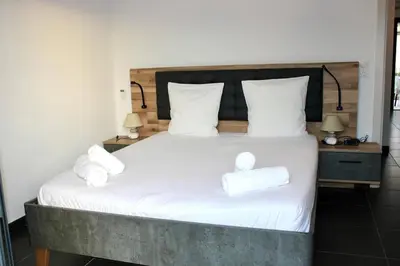 a bedroom with a bed with two towels on it at 9D - appartement Bonifacio Corse in Bonifacio
