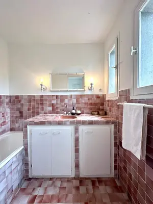 a bathroom with a sink and a tub at Villa Gardelina in Campomoro