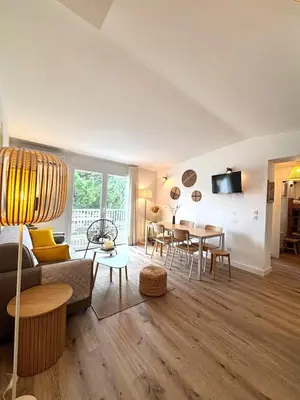 a living room with a couch and a table at fior di cala rossa in Lecci