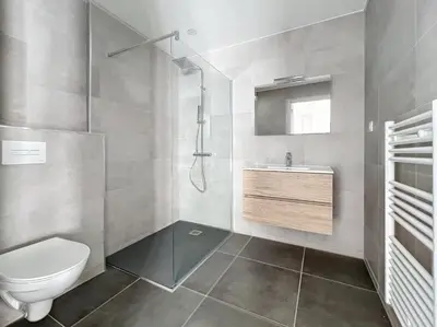 a bathroom with a toilet and a sink at Appartement T2 standing in Ajaccio