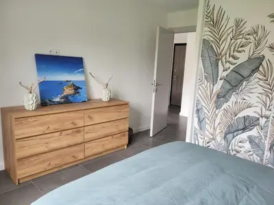 a balcony of a house with a view of the ocean at Appartement T2 standing in Ajaccio