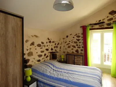 a bedroom with a bed and a window at Entre mer et maquis in Appietto