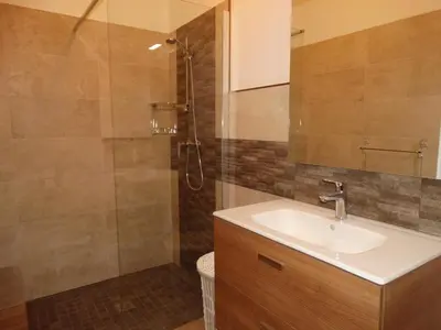 a bathroom with a sink and a shower at Entre mer et maquis in Appietto