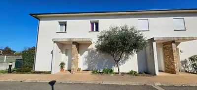 a white house with a tree in front of it at VERANU - Vue campagne- 5 mn de la plage de sable in Prunelli-di-Fiumorbo