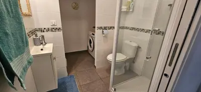 a small bathroom with a toilet and a sink at VERANU - Vue campagne- 5 mn de la plage de sable in Prunelli-di-Fiumorbo