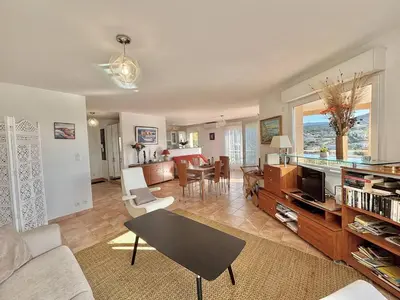 a living room with a couch and a tv at Villa 
