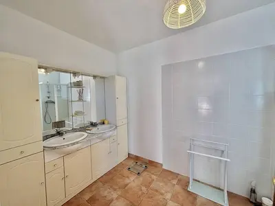 a bathroom with two sinks and a mirror at Villa 