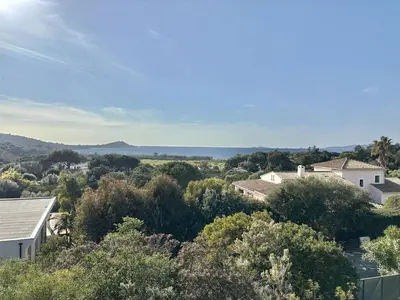an aerial view of a house with the ocean in the background at Villa 