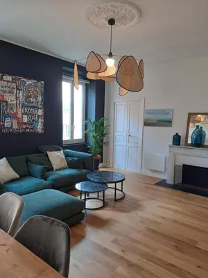 a living room with a couch and a table at Appartement centre ville in Ajaccio