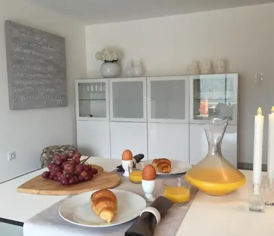 a kitchen with eggs and croissants on a counter at Neues, modernes Steinchalet mit grosser Terrasse und Pool bei Rondinara in Bonifacio
