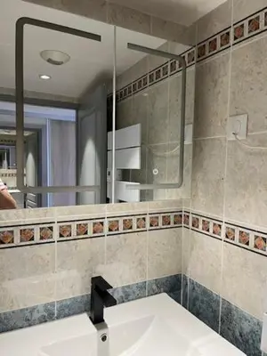 a bathroom with a sink and a mirror at Ajaccio appartement vue mer in Ajaccio
