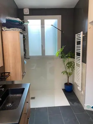 a kitchen with a sink and a window and a plant at Village vacations in Guarguale