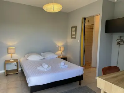 a bedroom with a bed with two towels on it at A Casuccia in Zonza