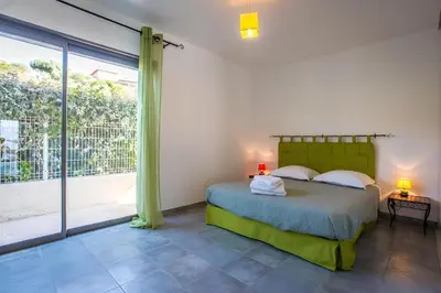 a bedroom with a bed and a large window at DelSol - Villa Pool Gorgeous Sea view - by TGB in Pietrosella