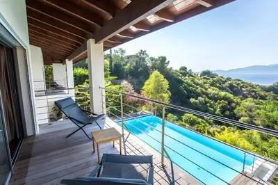 a balcony with a view of a swimming pool at DelSol - Villa Pool Gorgeous Sea view - by TGB in Pietrosella