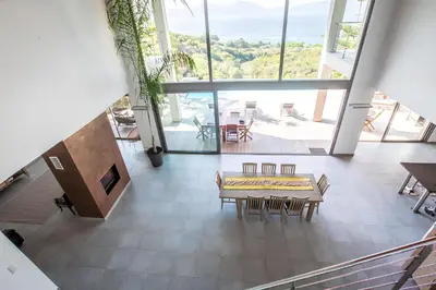 a dining room with a table and chairs in a building at DelSol - Villa Pool Gorgeous Sea view - by TGB in Pietrosella