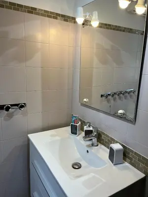 a bathroom with a white sink and a mirror at olmareddu in Alata