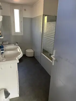 a bathroom with a sink and a toilet and a mirror at olmareddu in Alata