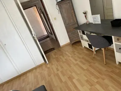 a room with a desk and a table and a chair at olmareddu in Alata