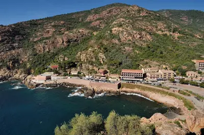 an aerial view of a resort on a mountain at Les Flots Bleus in Porto Ota