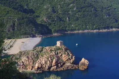 an island in the middle of a body of water at Les Flots Bleus in Porto Ota