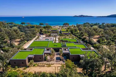 an aerial view of a resort with green lawns at Hôtel VILLA MAIER in Sainte-Lucie de Porto-Vecchio