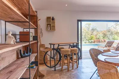 a house with a bike in the middle of a room at Villa Campemu Di Lecci in Lecci