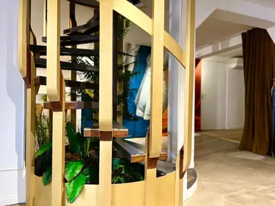 a wooden shelf with a fish tank in a room at Coliving Ajaccio in Ajaccio