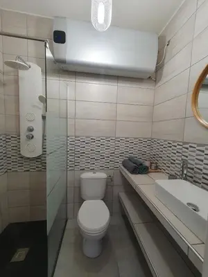 a bathroom with a toilet and a sink at studio cosy idéalement situé parking privé in Ajaccio