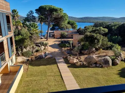 an aerial view of a garden with rocks and trees at APPT T3 terrasse dans résidence bord de mer avec piscine in Pianottoli-Caldarello