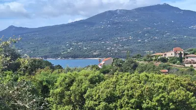 a view of a town and a lake on a mountain at Résidence Dolce Vita in Propriano