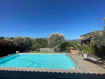 a large swimming pool in a yard at A Casetta Di Oletta in Oletta