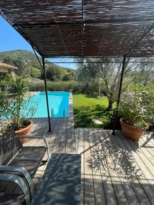 a patio with a view of a swimming pool at A Casetta Di Oletta in Oletta