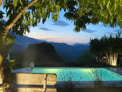 a pool with a view of the mountains at Appartement en Corse in Noceta