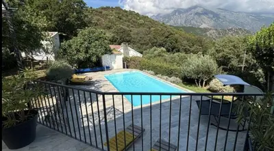 a view of a swimming pool on a balcony at Appartement en Corse in Noceta