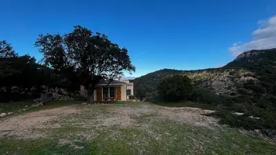 a small house in the middle of a field at Villa Porra 100m2, pleine nature, piscine, vue mer in Porto-Vecchio
