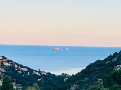 a view of a hill with houses on it at Villa Porra 100m2, pleine nature, piscine, vue mer in Porto-Vecchio