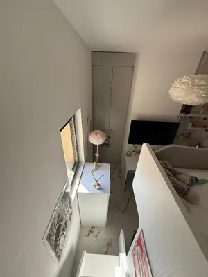 an overhead view of a living room with a table at Appartement de luxe type 4 Eden Suite Sanguinaires vue mer avec piscine chauffée résidence Ajaccio in Ajaccio
