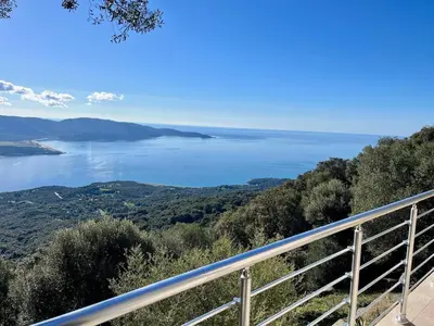 a view of the water from a balcony at Maison avec vue imprenable in Olmeto