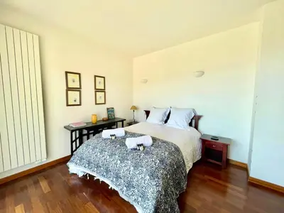 a bedroom with a bed with two towels on it at Casamea - Sagone, Villa Vue Mer, Clim, Piscine in Coggia