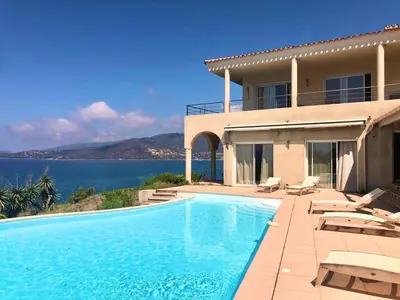 a house with a swimming pool next to the ocean at Casamea - Sagone, Villa Vue Mer, Clim, Piscine in Coggia