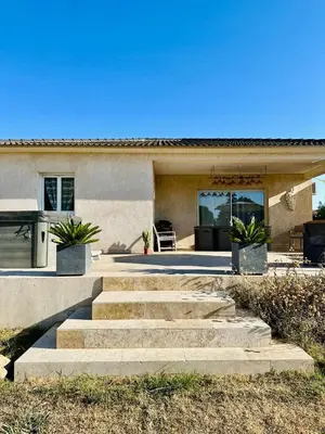 a set of stairs leading to a house at villa avec jacuzzi privé proche plage in Solaro