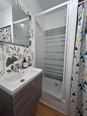 a bathroom with a toilet next to a door at T2 Cosy HYPER CENTRE AJACCIO in Ajaccio