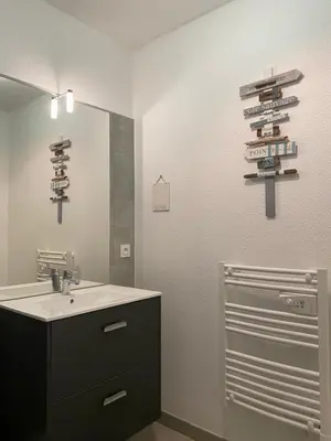 a bathroom with a sink and a mirror at A LAVANDA Maison BONIFACIO in Bonifacio