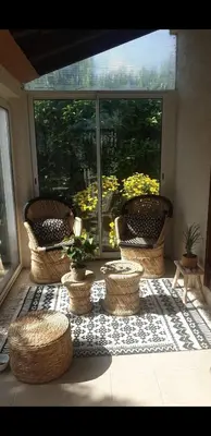 a patio with two chairs and a table and a bench at Villa Lina 6 pers plages et rivières in Prunelli-di-Fiumorbo