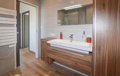 a bathroom with a white sink and a mirror at 2 Bedroom Lovely Home In Cervione in Cervione