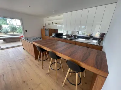 a kitchen with a wooden counter top and a wooden floor at Villa-de Luxe-Salle de bain-Vue sur la campagne à 5 minutes de la mer Qui est composé de 5 chambres in Venzolasca